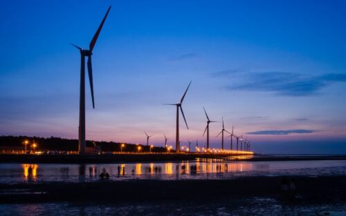 Wind turbines in a night sky