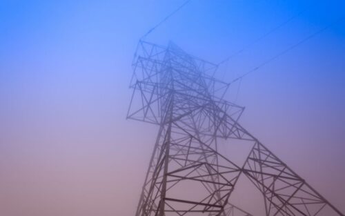 An electricity pylon on a moody sky