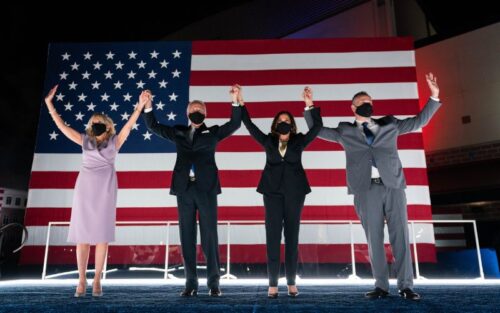 President and Dr Biden in front of an American Flag