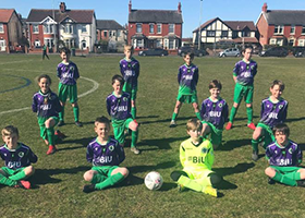 A young football team sporting shirts with BIU logo on